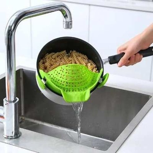 Strainer to drain excess liquid from the pot