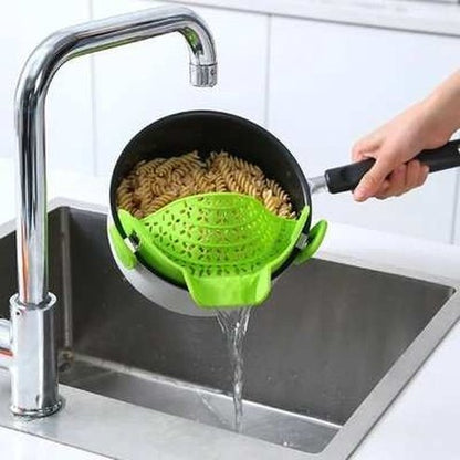 Strainer to drain excess liquid from the pot