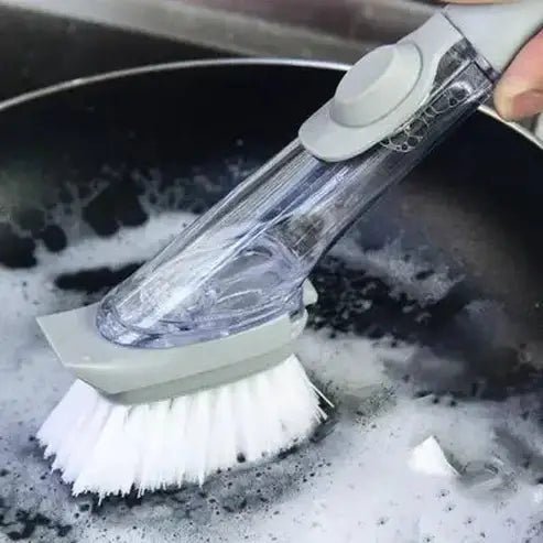 Scrub brush with self-dispensing soap tank