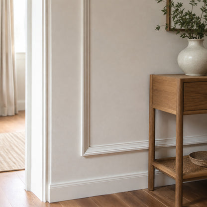 Close interior detail of crisp picture frame molding and finished baseboard