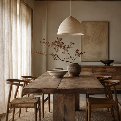 Natural wood dining room with soft linen curtains
